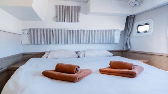 The comfortable cabin area on Lyubushka offers peaceful yacht charter experiences in Montenegro.
