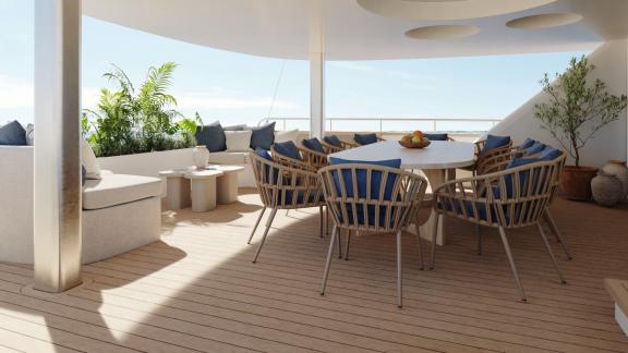 Outdoor deck with large dining table, surrounded by chairs and plants, on a yacht.