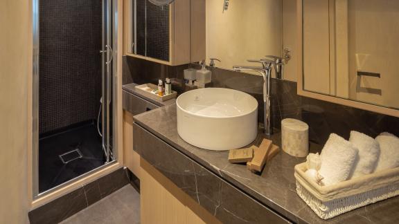 Luxurious bathroom on Motor Yacht Summer Fun with modern amenities and spacious shower.