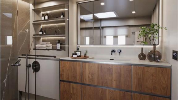 Modern sink, large storage and natural light in Ahalya’s bathroom.