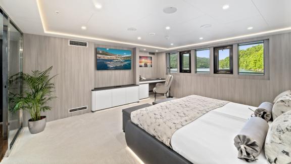 Enjoy the stunning panoramic views from this elegant bedroom.