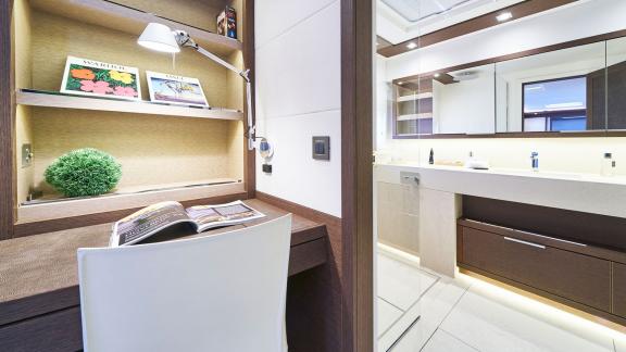 Compact workspace with a view into the modern bathroom on Lagoon Seventy 7.