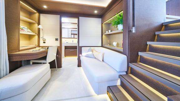 Spacious suite with workspace, sofa, and access to the bathroom on Lagoon Seventy 7.