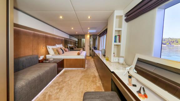 Spacious and stylish, Honeybird’s main cabin offers a luxurious charter stay with sea views in Šibenik.