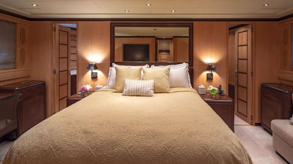 The master suite on Cosmos yacht blends warm tones with elegant comfort for true relaxation.