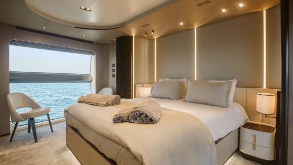 Comfortable and elegant cabin on the motor yacht Volante with a sea view.