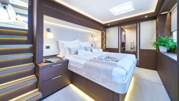 Spacious cabin with large double bed and stylish lighting on Lagoon Seventy 7.