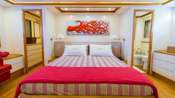 Comfortable and stylish master cabin with motoryacht rental in Naples.