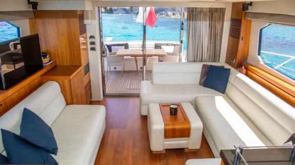 Spacious, comfortable lounge with sea view on the Midnight Summer Dream yacht.