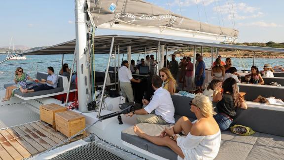 Social catamaran tour from Athens Alimos offers a lively Greece day cruise atmosphere.