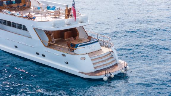 Among Cannes daily yacht rental options Ava motor yacht aft deck shows seating area and swim platform access.