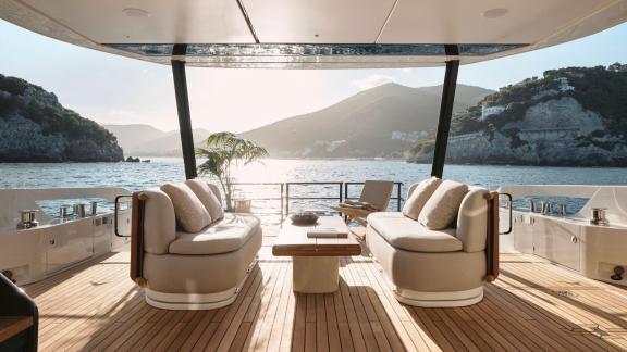 In Sibenik motor yacht charter option Balance aft deck with seating area table and panoramic sea view offering relaxing