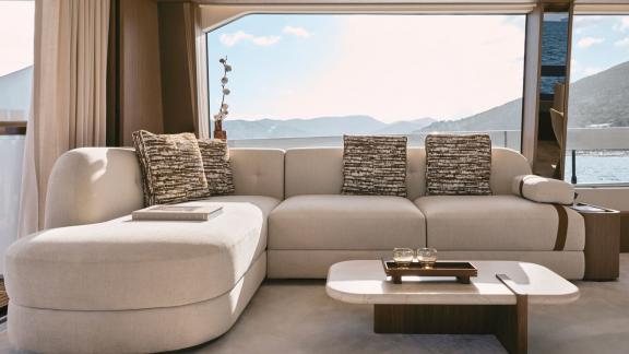 In Sibenik motor yacht charter option Balance salon with sofa and panoramic sea view offering relaxing comfort visible.