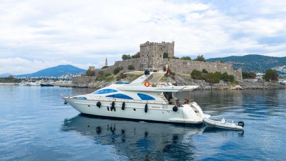 Barans cruises by Bodrum Castle, offering private motor yacht charters, VIP yacht tours and premium sea experiences.