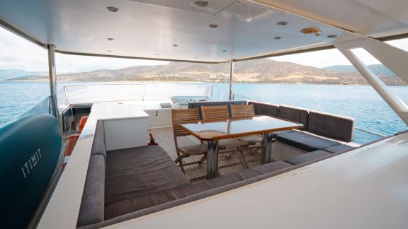 Bona Dea motor yacht in Gocek offers an upper deck space for outdoor dining with beautiful sea views.