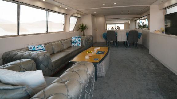 Bona Dea motor yacht in Gocek features a spacious saloon with elegant seating areas for onboard relaxation.