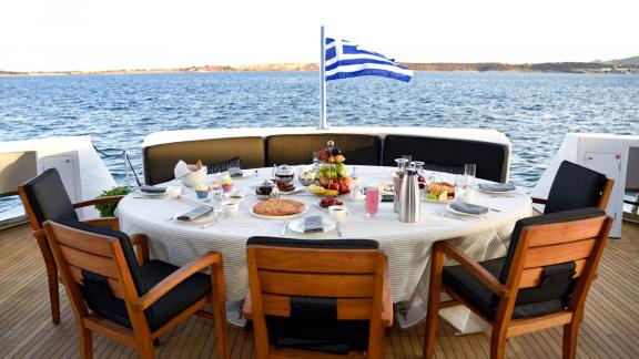 A beautifully set breakfast table overlooking the peaceful Aegean Sea.