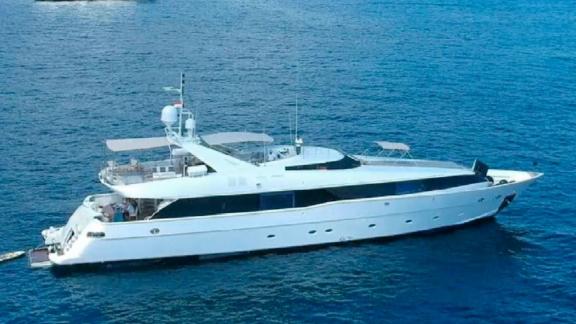 The luxury motor yacht Brooklyn is anchored off the coast of Athens, showcasing elegant lines and a sleek modern design.