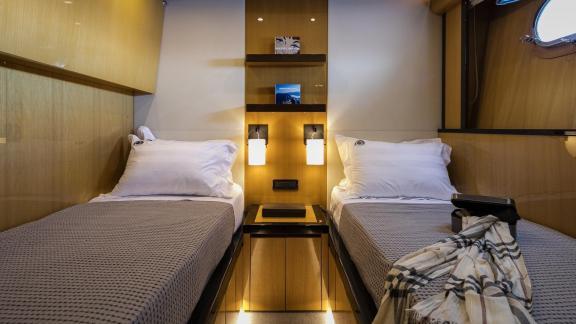 Cozy twin guest cabin on the 35m motor yacht in Mykonos.