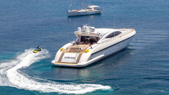 Enjoy the thrill of jet skiing and comfort aboard the sleek Cosmos yacht.