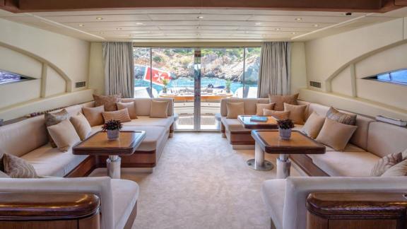 Cosmos yacht offers a spacious salon with sea views for stylish and cozy gatherings.