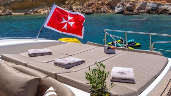 Relax in nature on Cosmos’ aft deck sunpads while anchored in a stunning secluded turquoise bay.