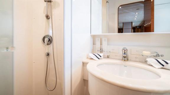 Available for charter in Athens the 4 cabin 10 guest Falcon 86 Estia Poseidon motor yacht includes a bathroom with showe