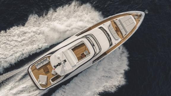 In Sibenik motor yacht charter option First Horizon aerial view cruising with visible wake and deck layout.