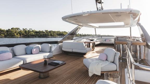 In Sibenik motor yacht charter option First Horizon upper deck with lounge seating and table visible.