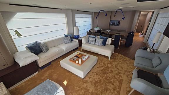 In Sibenik motor yacht charter option First Horizon interior salon with seating and dining area visible.