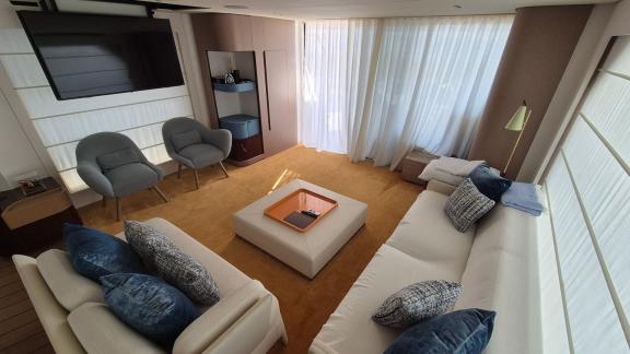 In Sibenik motor yacht charter option First Horizon interior salon with sofas and TV area visible.