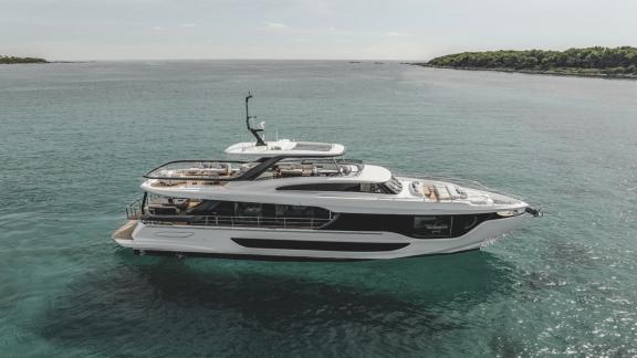 In Sibenik motor yacht charter option First Horizon anchored at sea with spacious deck and upper lounge visible.