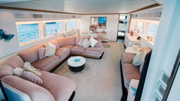 Among Ibiza weekly yacht charter options, Lady KC is seen with a spacious sea view main salon.