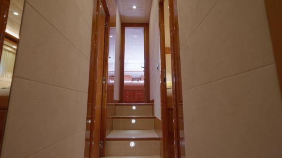 Among motor yacht rental options in Rhodes Lady Natassa interior corridor with stairs and cabin access is seen.