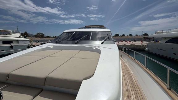 At Athens coast foredeck of Mammas motor yacht with sun pads and relaxation area.