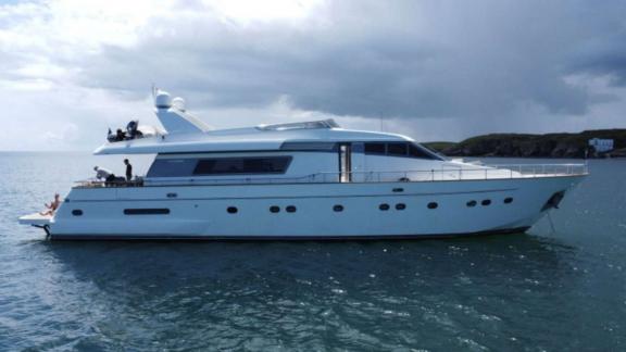 Mammas motor yacht anchored near Athens coast. Four cabins provide comfortable yacht charter for up to 8 guests.