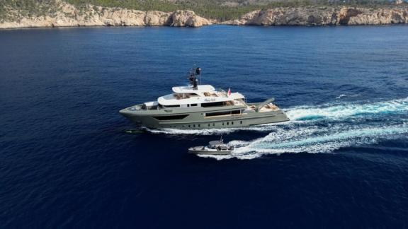 In Spain weekly yacht rental options Moka shows fast cruising with support boat.