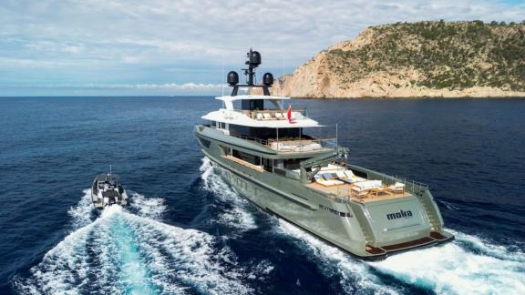 In Spain weekly yacht rental options Moka shows open sea cruising with tender boat.