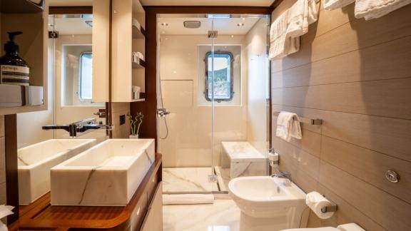 In Spain weekly yacht rental options Moka shows large bathroom and comfort.