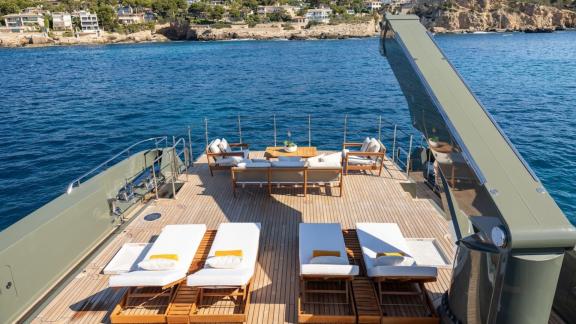 In Spain weekly yacht rental options Moka shows sunbeds and relaxing deck space.