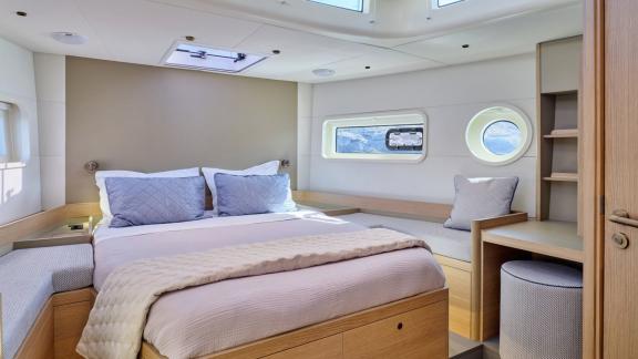 Off Lavrion the 3 cabin 6 guest Omikron Yachts OT 60 N ice featuring a bright double cabin with large bed.