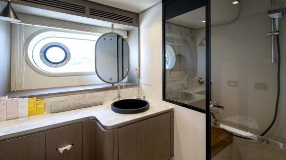 Features a panoramic window, elegant basin, and spacious shower for a refined experience.