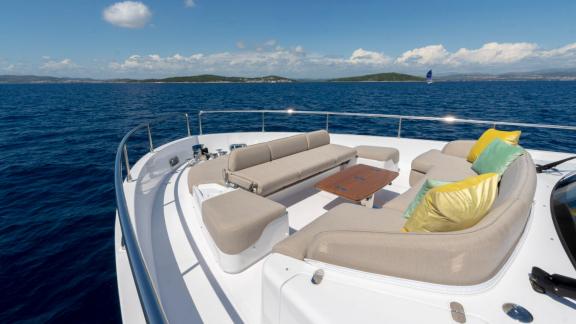 Olivia’s cozy bow area with colorful cushions, anchored near Šibenik.