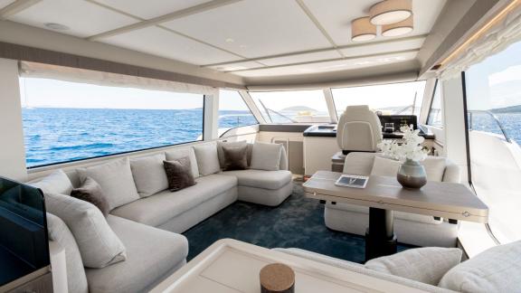 Spacious salon with elegant seating and sea views aboard the motor yacht Olivia in Šibenik.