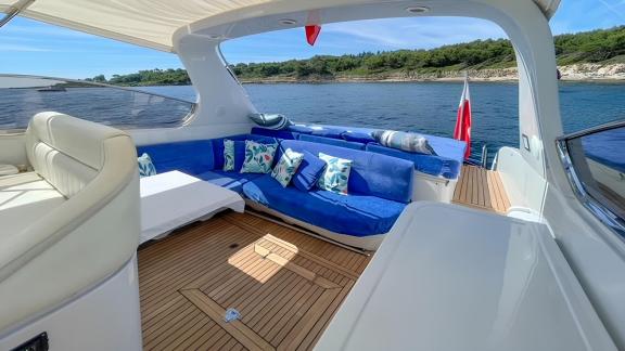 Among Cannes daily yacht rental options Omarta aft deck shows seating area with sea view for relaxation.