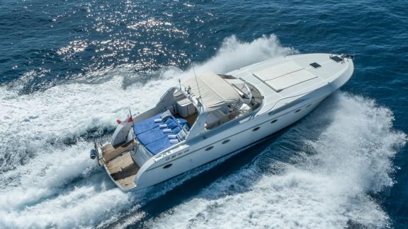 Among Cannes daily yacht rental options Omarta is seen cruising fast in open sea.