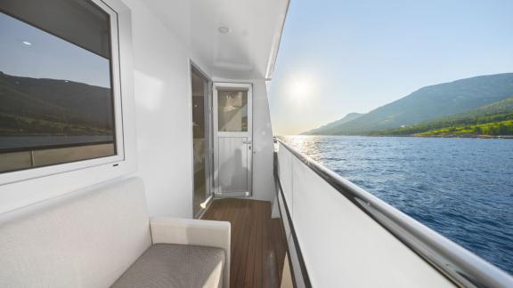 Side deck of the Premier motor yacht in Split, offering private spaces and uninterrupted sea views during luxury cruises