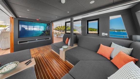 Media lounge on the Premier motor yacht in Split, designed for movie nights, games and onboard entertainment.