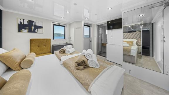 Spacious guest suite on the Premier motor yacht in Split, offering privacy and premium comfort during private charters.