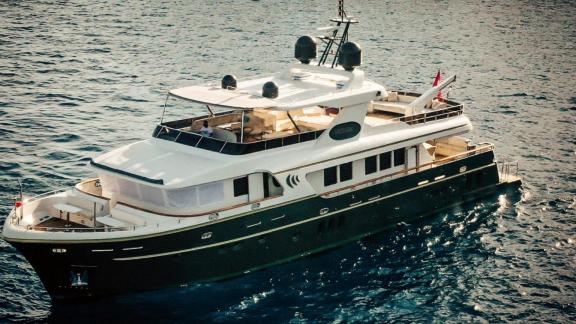Among Göcek yacht charter options the 5 cabin 10 guest River Storm motor yacht cruising at sea.